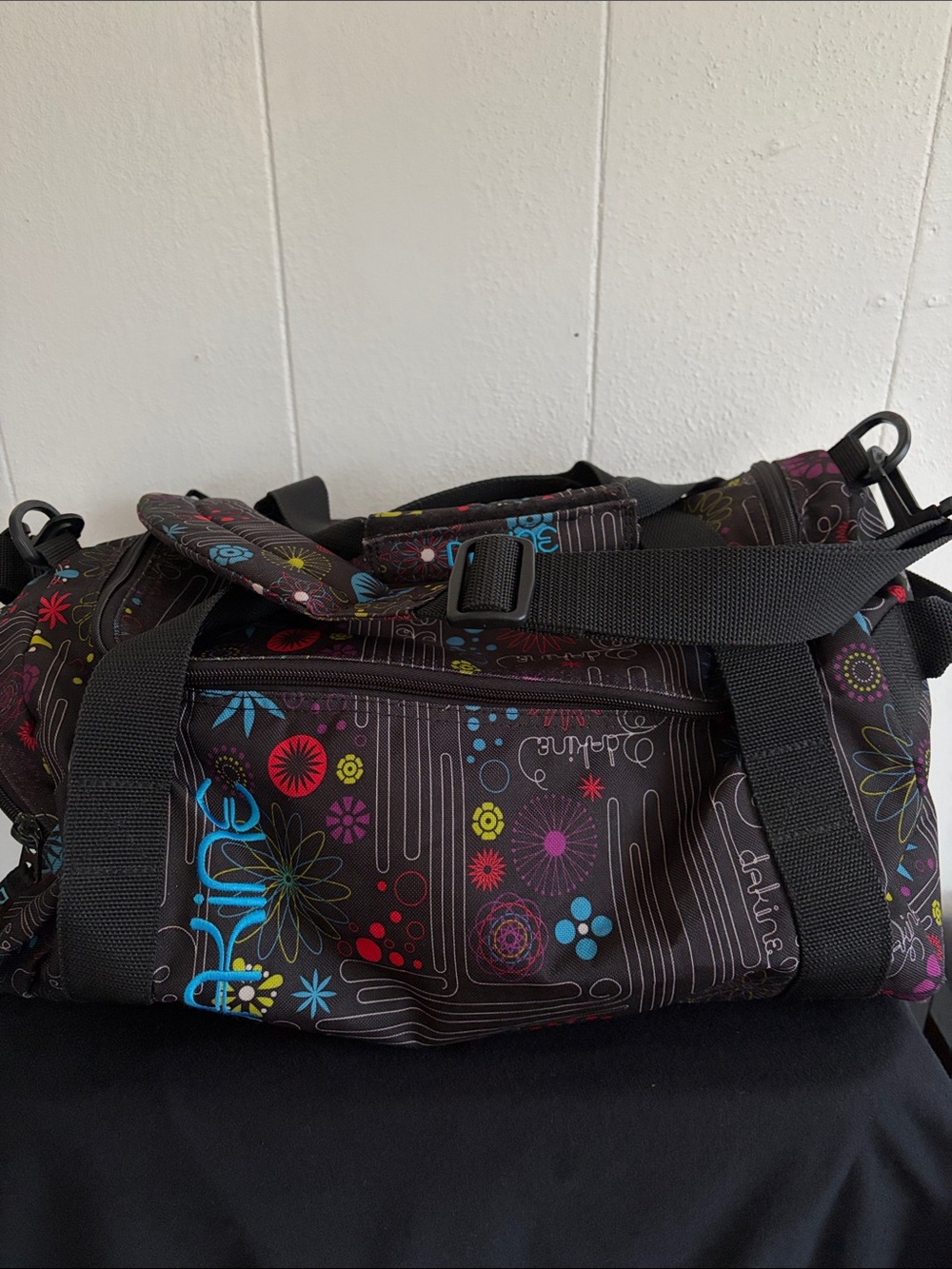 Dakine Black Duffle with Bright Floral Graphic